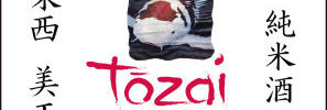 A koi fish swims on a sake label that reads “Tozai Junmai Living Jewel Premium Japanese Sake” from Tozai Wine.